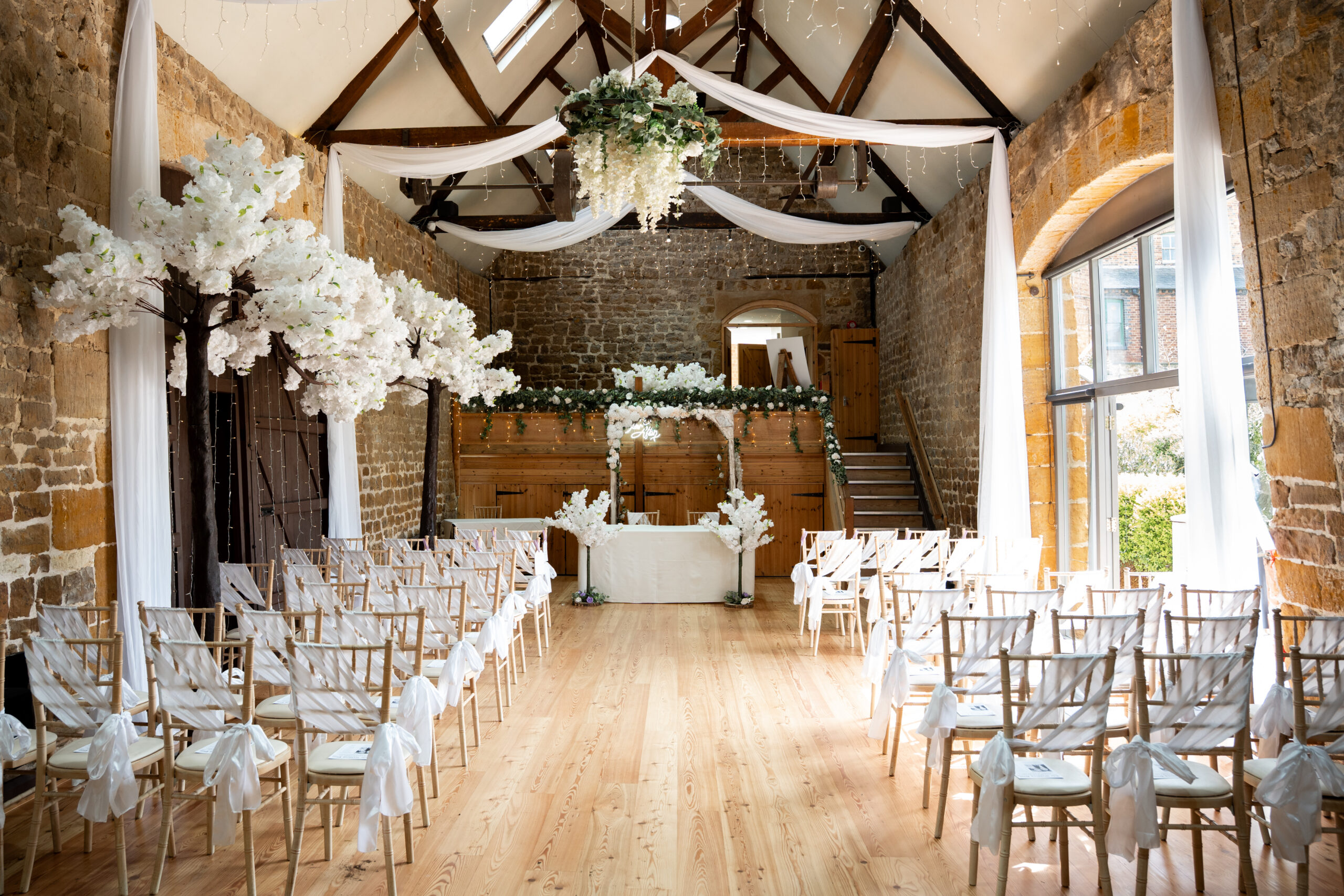 inside the barns at hunsbury hill at a magical barn wedding