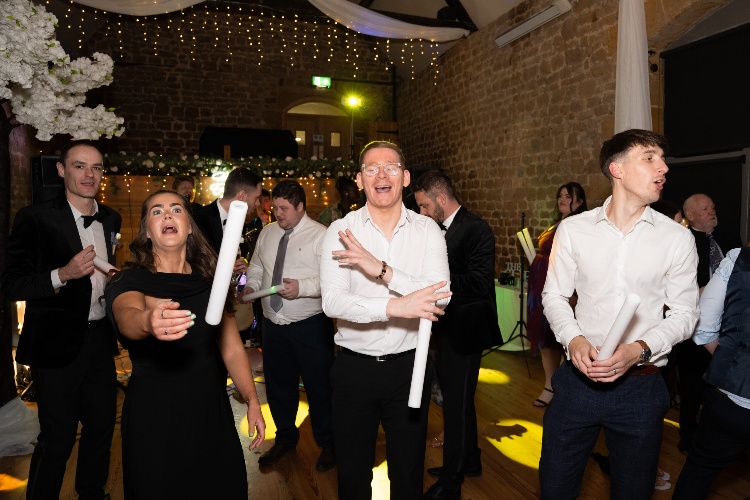 fun on the dance floor at a magical barn wedding