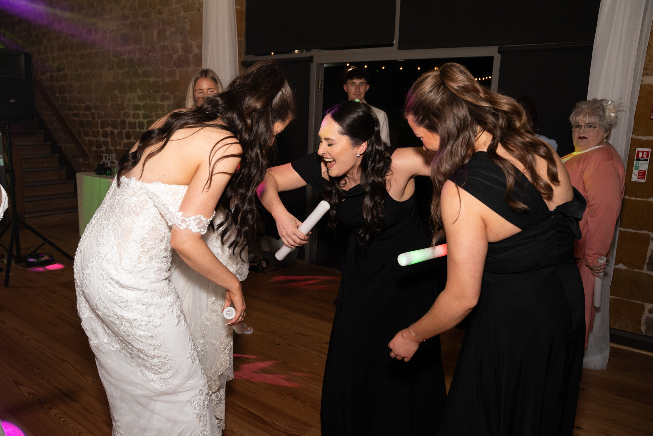bride and bridesmaids on the dance floor
